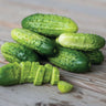 Green boston pickling cucumbers on a wooden surface