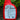 Red spray bottle of squirrel stopper repellent with label on a garden background.