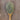 Organic, dark green and brown veggie pepper on a rustic wooden spoon.